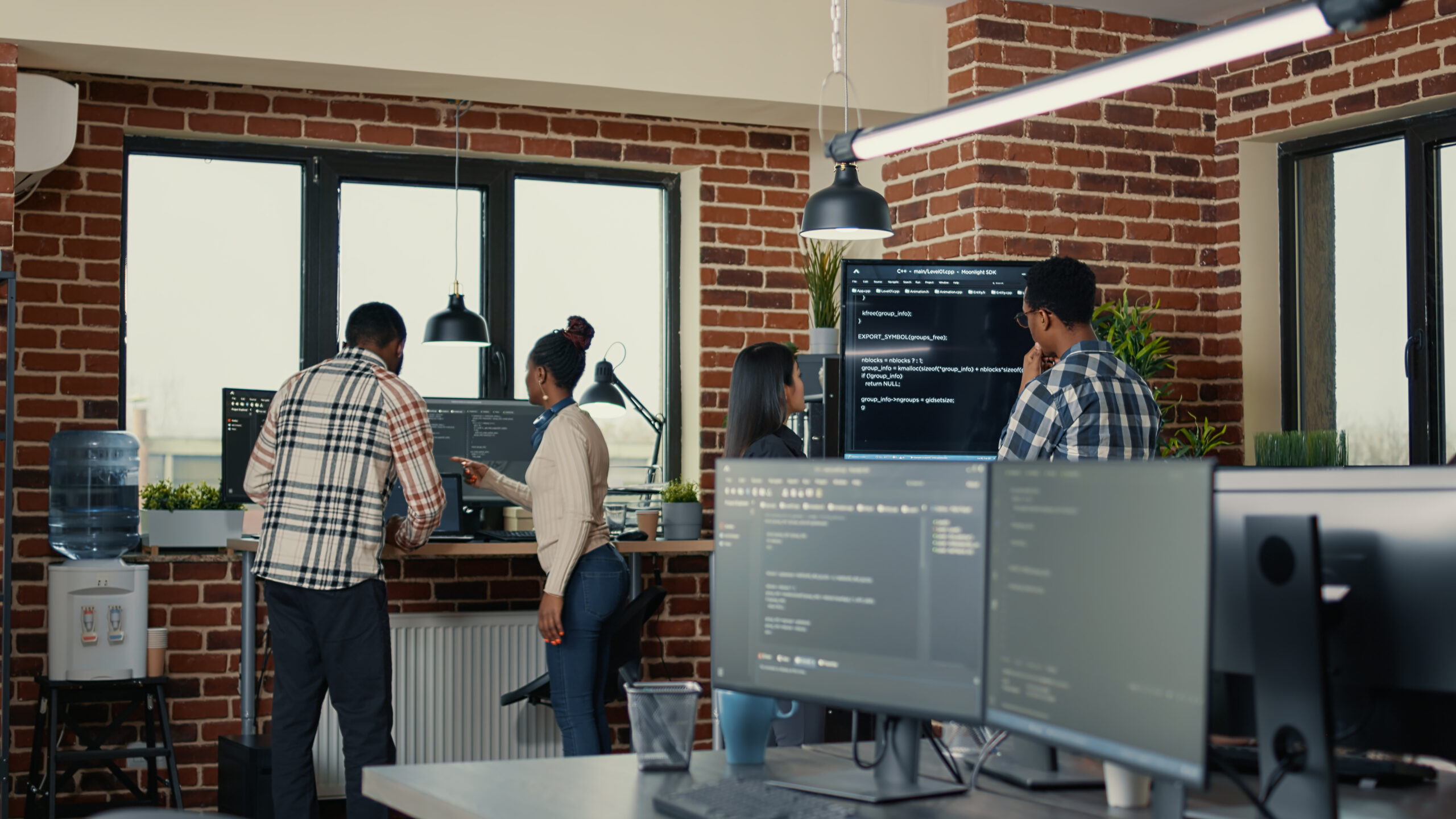 System Developers Analyzing Code Wall Screen Tv Looking Errors While Team Coders Collaborate Artificial Intelligence Project Programmers Working Together Machine Learning Software Scaled